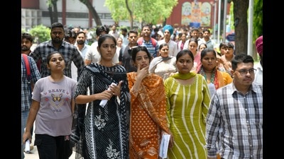 Candidates coming out a CET exam centre at Government Model School, Sector 18, Chandigarh, on Saturday afternoon. (Ravi Kumar/HT) Candidates coming out a CET exam centre at Government Model School, Sector 18, Chandigarh, on Saturday afternoon. (Ravi Kumar/HT)