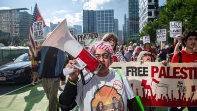 Pro-Palestinian demonstrators march in the seaport district during a ‘Stop starving Gaza’ protest and rally in Boston, Massachusetts on July 25, 2025. (AFP)