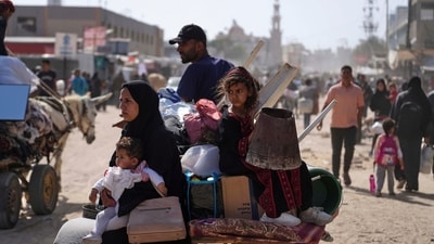 Displaced Palestinians flee from their homes in Gaza amid the ongoing Israeli military offensive. (AP File) Displaced Palestinians flee from their homes in Gaza amid the ongoing Israeli military offensive. (AP File)