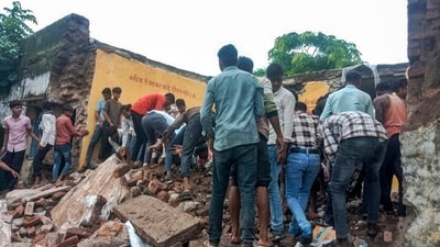 Locals during the rescue work after a government school building collapsed, in Jhalawar district, Rajasthan, Friday, July 25, 2025. (PTI) Locals during the rescue work after a government school building collapsed, in Jhalawar district, Rajasthan, Friday, July 25, 2025. (PTI)
