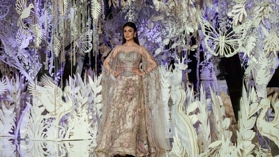 Riddhima Kapoor Sahni strutted down the ramp in a stunning dress featuring intricate floral work. She walked for designer Suneet Verma. (ANI Photo/Rahul Singh) Riddhima Kapoor Sahni strutted down the ramp in a stunning dress featuring intricate floral work. She walked for designer Suneet Verma. (ANI Photo/Rahul Singh)