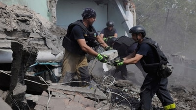 Rescuers clear the rubble after a Russian guided air bomb hit a building in Ukraine, (AP) Rescuers clear the rubble after a Russian guided air bomb hit a building in Ukraine, (AP)