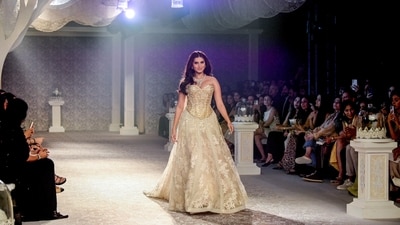 Tara Sutaria walked the ramp in a gorgeous champagne-hued gown. The gown embraced a light, feminine style from head to toe. The voluminous skirt flared out from the waistline of the fitted bodice, giving it a princess-style vibe. (ANI Photo/Rahul Singh) Tara Sutaria walked the ramp in a gorgeous champagne-hued gown. The gown embraced a light, feminine style from head to toe. The voluminous skirt flared out from the waistline of the fitted bodice, giving it a princess-style vibe. (ANI Photo/Rahul Singh)