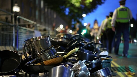 Police officers stand near pots and pans, which were banged by demonstrators during a pro-Palestinian demonstration to honour the Palestinians shot while queuing for food in Gaza, in London, Britain, July 25, 2025.(REUTERS/Isabel Infantes)