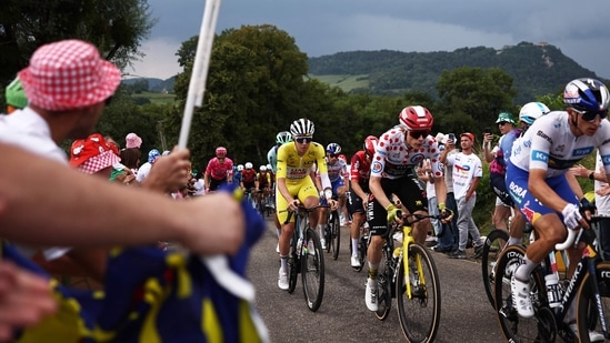 Slovenian rider Tadej Pogacar is on track to secure his fourth Tour de France title. (AFP)