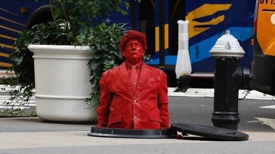 Trump, dressed in a suit and tie, was depicted in the statue staring up with his lips pursed and his face serious.