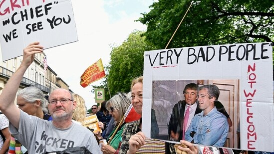 A protester holds a placard with an image of U.S. President Donald Trump and Jeffrey Epstein, as anti-Trump demonstrators gather during a rally organised by the campaign group Stop Trump Coalition, protesting the visit of Donald Trump, in Edinburgh, Scotland, Britain, July 26, 2025. REUTERS/Lesley Martin(REUTERS)