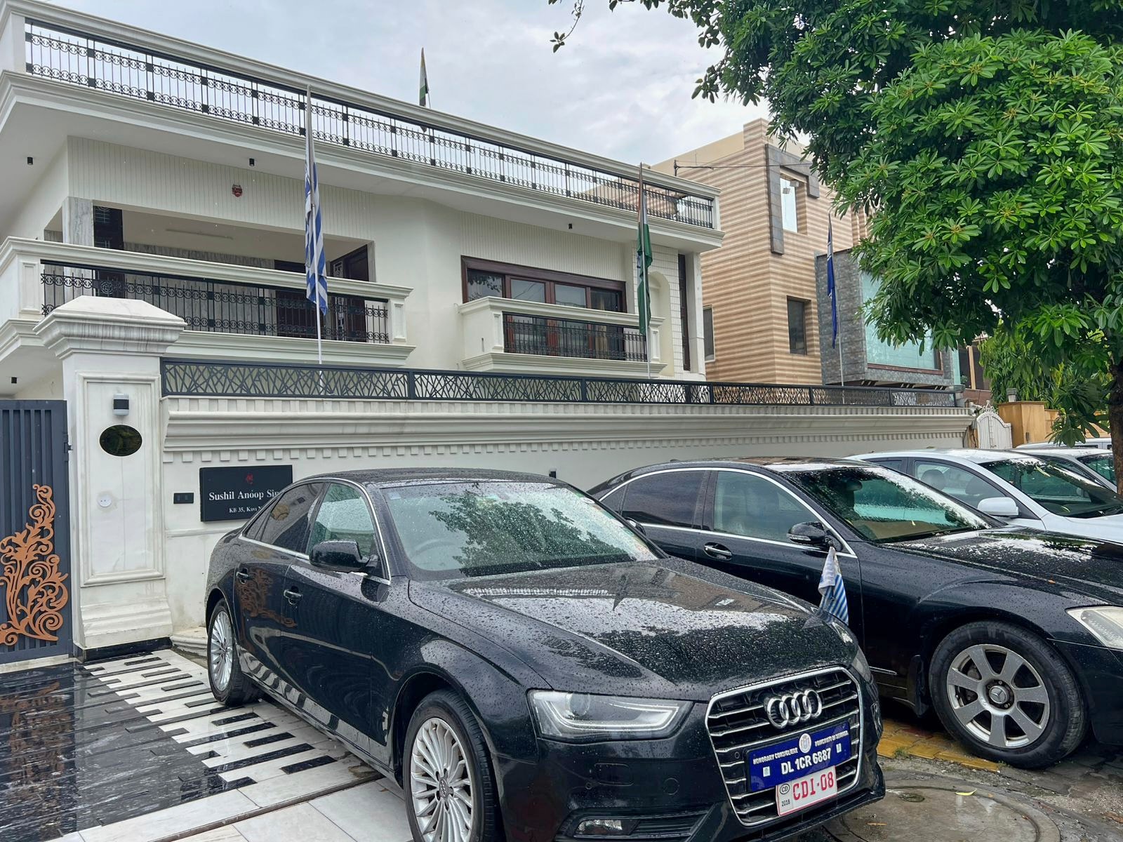 Luxury cars cars bearing fake diplomatic number plates are parked outside a rented residential building in which a bogus embassy was running in Ghaziabad, outskirts of New Delhi, (AP) Luxury cars cars bearing fake diplomatic number plates are parked outside a rented residential building in which a bogus embassy was running in Ghaziabad, outskirts of New Delhi, (AP)