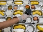 This picture taken on June 23, 2025 shows personnel from one of the nutrition service units preparing meals for elementary and middle school students in Jakarta. Indonesian President Prabowo Subianto touted the populist scheme as a solution to the high rates of stunted growth among children, as he carved his way to a landslide election victory last year. But its rollout since January has stumbled from crisis to crisis, including accusations of nepotism, funding delays, protests and a spate of food poisonings. (Photo by BAY ISMOYO / AFP) / To go with AFP story Indonesia-politics-food-economy, FOCUS by Dessy SAGITA This picture taken on June 23, 2025 shows personnel from one of the nutrition service units preparing meals for elementary and middle school students in Jakarta. Indonesian President Prabowo Subianto touted the populist scheme as a solution to the high rates of stunted growth among children, as he carved his way to a landslide election victory last year. But its rollout since January has stumbled from crisis to crisis, including accusations of nepotism, funding delays, protests and a spate of food poisonings. (Photo by BAY ISMOYO / AFP) / To go with AFP story Indonesia-politics-food-economy, FOCUS by Dessy SAGITA