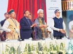 Justice Surya Kant, J&K Lt Guv Manoj Sinha, J&K CM Omar Abdullah and Union law minister Arjun Ram Meghwal during the launch of Veer Parivar Sahayata Yojana in Srinagar. (HT Photor) Justice Surya Kant, J&K Lt Guv Manoj Sinha, J&K CM Omar Abdullah and Union law minister Arjun Ram Meghwal during the launch of Veer Parivar Sahayata Yojana in Srinagar. (HT Photor)