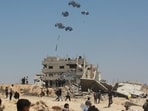 A military transport aircraft drops humanitarian aid over the northern Gaza Strip, on July 27, 2025.