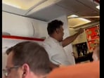 Other passengers are then seen tackling him to the floor of the plane. Other passengers are then seen tackling him to the floor of the plane.