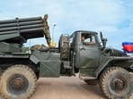 A Cambodian soldier stands on a truck carrying a Russian-made BM-21 rocket launcher travelling along a street in Oddar Meanchey province. A Cambodian soldier stands on a truck carrying a Russian-made BM-21 rocket launcher travelling along a street in Oddar Meanchey province.