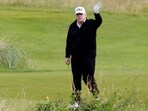 U.S. President Donald Trump waves on the golf course at Trump Turnberry resort in Turnberry, Scotland, Britain.