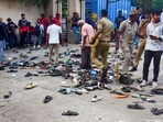 Footwears lie on the ground outside the Chinnaswamy Stadium following a stampede after a large number of fans gathered for the felicitation of IPL 2025 winning Royal Challengers Bengaluru in Bengaluru, Karnataka, Wednesday, June 4, 2025. Footwears lie on the ground outside the Chinnaswamy Stadium following a stampede after a large number of fans gathered for the felicitation of IPL 2025 winning Royal Challengers Bengaluru in Bengaluru, Karnataka, Wednesday, June 4, 2025.