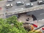A car plunged into a large, water-filled sinkhole in Singapore on July 26.