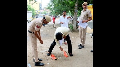 A candidate being checked before he appears in the Haryana Staff Selection Commission (HSSC) Common Eligibility Test (CET) 2025 in Gurugram on Sunday. (PTI) A candidate being checked before he appears in the Haryana Staff Selection Commission (HSSC) Common Eligibility Test (CET) 2025 in Gurugram on Sunday. (PTI)
