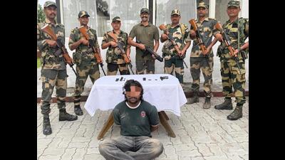 Accused arrested from a brick kiln near Bachiwind village in Amritsar in BSF’s custody in Amritsar on Saturday. (HT Photo)