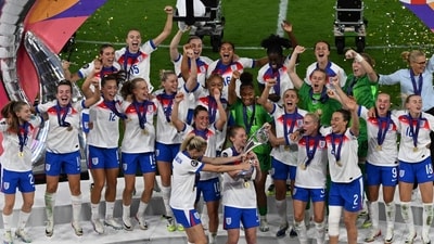 England's defender #06 Leah Williamson (Front L), England's midfielder #04 Keira Walsh (C) and England's defender #02 Lucy Bronze (3rdR) lift the trophy as England celebrate winning the UEFA Women's Euro 2025 final football match between England and Spain at the St. Jakob-Park Stadium in Basel, on July 27, 2025. (Photo by Miguel MEDINA / AFP) (AFP) England's defender #06 Leah Williamson (Front L), England's midfielder #04 Keira Walsh (C) and England's defender #02 Lucy Bronze (3rdR) lift the trophy as England celebrate winning the UEFA Women's Euro 2025 final football match between England and Spain at the St. Jakob-Park Stadium in Basel, on July 27, 2025. (Photo by Miguel MEDINA / AFP) (AFP)