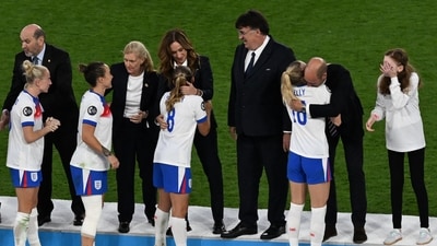 Britain's Prince William, Prince of Wales (2ndR) hugs England's forward #18 Chloe Kelly as England celebrate winning the UEFA Women's Euro 2025 final football match between England and Spain at the St. Jakob-Park Stadium in Basel, on July 27, 2025. (Photo by Miguel MEDINA / AFP) (AFP) Britain's Prince William, Prince of Wales (2ndR) hugs England's forward #18 Chloe Kelly as England celebrate winning the UEFA Women's Euro 2025 final football match between England and Spain at the St. Jakob-Park Stadium in Basel, on July 27, 2025. (Photo by Miguel MEDINA / AFP) (AFP)