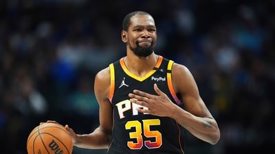 Former Phoenix Suns forward Kevin Durant gestures during the second half of an NBA basketball game on March 9 (AP)