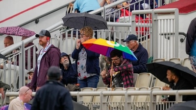 Fans in the stands as rain stops play on day two of the fourth test cricket match between India and England, at the Old Trafford Cricket Ground (PTI) Fans in the stands as rain stops play on day two of the fourth test cricket match between India and England, at the Old Trafford Cricket Ground (PTI)