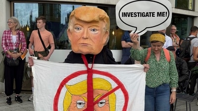 People take part in a Stop Trump Scotland protest at the Union Terrace Gardens in Aberdeen, as President Donald Trump begins his five-day private trip to the country at his Turnberry golf course in South Ayrshire on Saturday July 26, 2025. (Nick Forbes /PA via AP) (AP) People take part in a Stop Trump Scotland protest at the Union Terrace Gardens in Aberdeen, as President Donald Trump begins his five-day private trip to the country at his Turnberry golf course in South Ayrshire on Saturday July 26, 2025. (Nick Forbes /PA via AP) (AP)