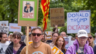 People take part in a Stop Trump Scotland protest outside the US Consulate in Edinburgh, as US President Donald Trump begins his five-day private trip to the country at his Turnberry golf course in South Ayrshire on Saturday July 26, 2025. ( Jane Barlow /PA via AP) (AP) People take part in a Stop Trump Scotland protest outside the US Consulate in Edinburgh, as US President Donald Trump begins his five-day private trip to the country at his Turnberry golf course in South Ayrshire on Saturday July 26, 2025. ( Jane Barlow /PA via AP) (AP)