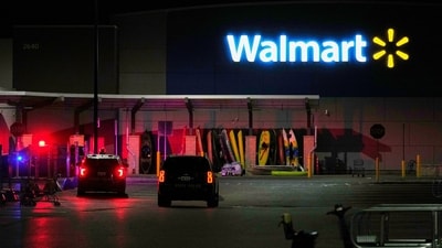 Law enforcement officers are seen stationed outside a Walmart where 11 people were stabbed in a violent attack Saturday, July 26, 2025, in Traverse City, Mich (AP Photo/Ryan Sun) (AP) Law enforcement officers are seen stationed outside a Walmart where 11 people were stabbed in a violent attack Saturday, July 26, 2025, in Traverse City, Mich (AP Photo/Ryan Sun) (AP)