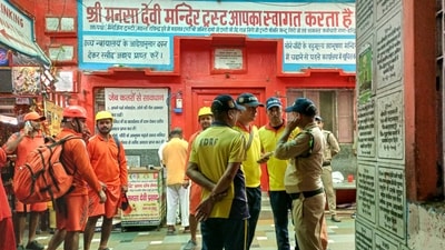 Local authorities and State Disaster Response Force gathered at the stampede site in Mansa Devi Temple after the incident (PTI) Local authorities and State Disaster Response Force gathered at the stampede site in Mansa Devi Temple after the incident (PTI)