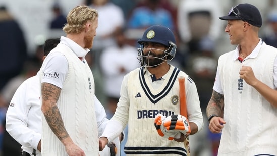 Ben Stokes, left, speaks with India's Ravindra Jadeja, centre, as Brydon Carse looks on (AFP)