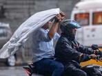 People going through the rain at Andheri in Mumbai, India, on Friday, July 25, 2025.  