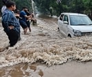Commuters wade through waterlogged roads on the Sector 36/37 dividing road; and (right) the Panjab University campus following the rain on Sunday. (Keshav Singh/HT) Commuters wade through waterlogged roads on the Sector 36/37 dividing road; and (right) the Panjab University campus following the rain on Sunday. (Keshav Singh/HT)