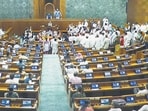 Opposition lawmakers in the Lok Sabha protest seeking a discussion on Operation Sindoor on the first day of the monsoon session of Parliament on Monday. (PTI)