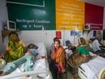 Barabanki: Family members sit beside injured people undergoing treatment at a hospital following a stampede at Avsaneshwar temple. Barabanki: Family members sit beside injured people undergoing treatment at a hospital following a stampede at Avsaneshwar temple.