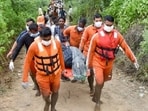 Rescuers bringing the bodies of two of the six victims of an overloaded mini-truck that fell into the Sirhind Canal in Ludhiana district on Sunday night.