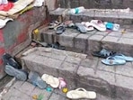 Footwear lay scattered at the spot following a stampede at the Mansa Devi temple, in Haridwar on Sunday. 8 people died and other 30 were left injured. Footwear lay scattered at the spot following a stampede at the Mansa Devi temple, in Haridwar on Sunday. 8 people died and other 30 were left injured.
