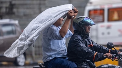 People going through the rain at Andheri in Mumbai, India, on Friday, July 25, 2025. (Satish Bate/ HT Photo) People going through the rain at Andheri in Mumbai, India, on Friday, July 25, 2025. (Satish Bate/ HT Photo)