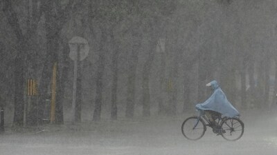 Colossal rain continued to pound the northwestern suburban area of Miyun in Beijing causing flash floods and landslides, and many villages were affected, state broadcaster CCTV reported. (AP) Colossal rain continued to pound the northwestern suburban area of Miyun in Beijing causing flash floods and landslides, and many villages were affected, state broadcaster CCTV reported. (AP)
