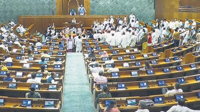 Opposition lawmakers in the Lok Sabha protest seeking a discussion on Operation Sindoor on the first day of the monsoon session of Parliament on Monday. (PTI) (PTI)