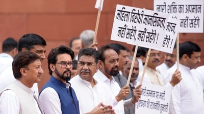 Meanwhile NDA leaders, including BJP MP Anurag Thakur, also staged a protest in the Parliament complex. They slammed All India Imam Association (AIIA) chief Moulana Sajid Rashidi's alleged derogatory remark against SP MP Dimple Yadav during a TV debate. (PTI) Meanwhile NDA leaders, including BJP MP Anurag Thakur, also staged a protest in the Parliament complex. They slammed All India Imam Association (AIIA) chief Moulana Sajid Rashidi's alleged derogatory remark against SP MP Dimple Yadav during a TV debate. (PTI)