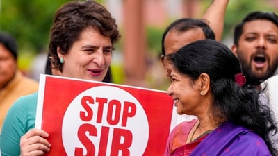 Congress MP Priyanka Gandhi Vadra seen interacting with DMK MP Kanimozhi Karunanidhi during the protest led by INDIA bloc leaders against the Special Intensive Revision (SIR) of electoral rolls in Bihar. (PTI) Congress MP Priyanka Gandhi Vadra seen interacting with DMK MP Kanimozhi Karunanidhi during the protest led by INDIA bloc leaders against the Special Intensive Revision (SIR) of electoral rolls in Bihar. (PTI)