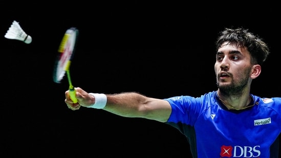 India's Lakshya Sen hits a return against Japan's Kodai Naraoka during their men's singles match of the Japan Open badminton tournament at Tokyo Gymnasium in Tokyo on July 17, 2025. (Photo by Yuichi YAMAZAKI / AFP) (AFP)
