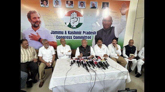J&K Congress president Tariq Hameed Karra along with party leaders address a press conference. (HT Photo)