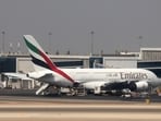 An Emirates Airlines Airbus A380 is parked at Cairo International Airport.