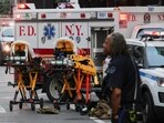 Stretchers are prepared as emergency services gather during a reported active shooter situation in the Manhattan borough of New York City, U.S. July 28, 2025. REUTERS/Jeenah Moon