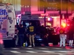 Law enforcement officers work near the scene of a reported shooter situation in the Manhattan borough of New York City, U.S. July 28, 2025. REUTERS/Eduardo Munoz