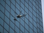 A New York Police Department (NYPD) helicopter reflected in windows near the scene of a shooting at 345 Park Ave. in New York, US, on Monday, July 28, 2025. A New York Police Department (NYPD) helicopter reflected in windows near the scene of a shooting at 345 Park Ave. in New York, US, on Monday, July 28, 2025.