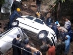 Rescue and restoration efforts underway on Jail Road in Mandi town of Himachal Pradesh after the flash flood on Tuesday morning left vehicles and property damaged. (HT Photo) Rescue and restoration efforts underway on Jail Road in Mandi town of Himachal Pradesh after the flash flood on Tuesday morning left vehicles and property damaged. (HT Photo)