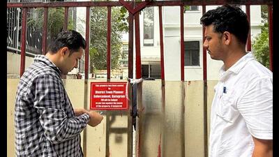 DTCP enforcement team sealing a property for violations in Sushant Lok on Tuesday. (HT Photo)